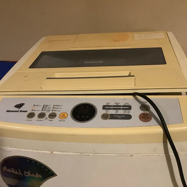 Samsung top-load washing machine control panel with digital display