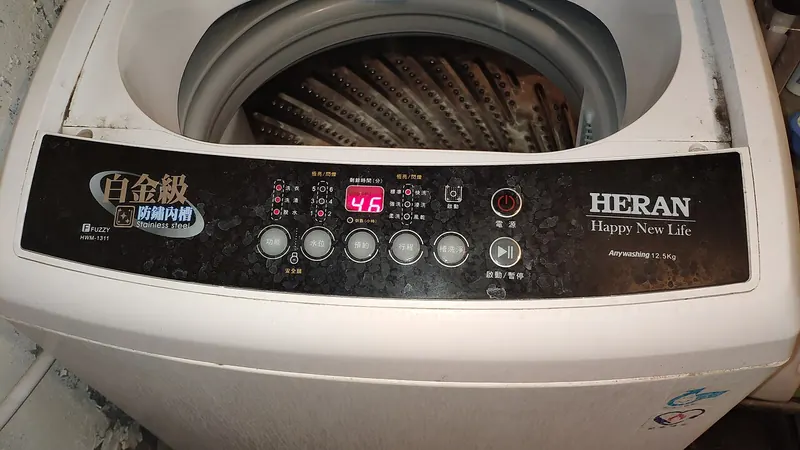 Top-load washing machine control panel with a red digital display