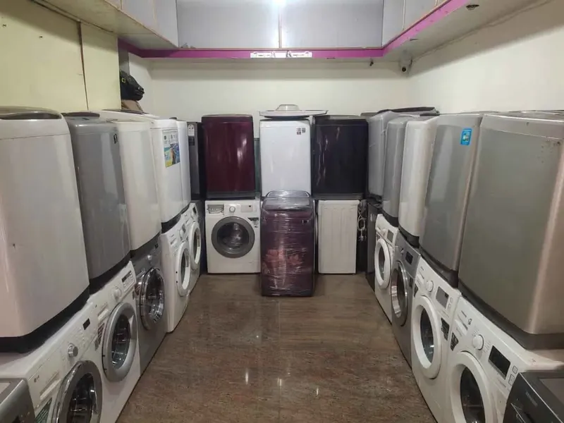 Washing Machine Specialist workshop with repaired washing machines